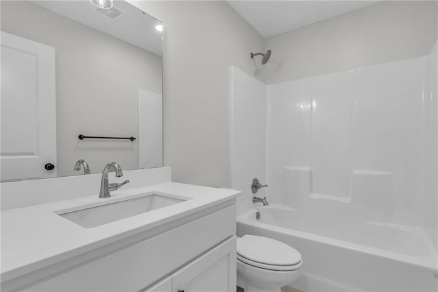 bathroom featuring toilet, washtub / shower combination, visible vents, and vanity