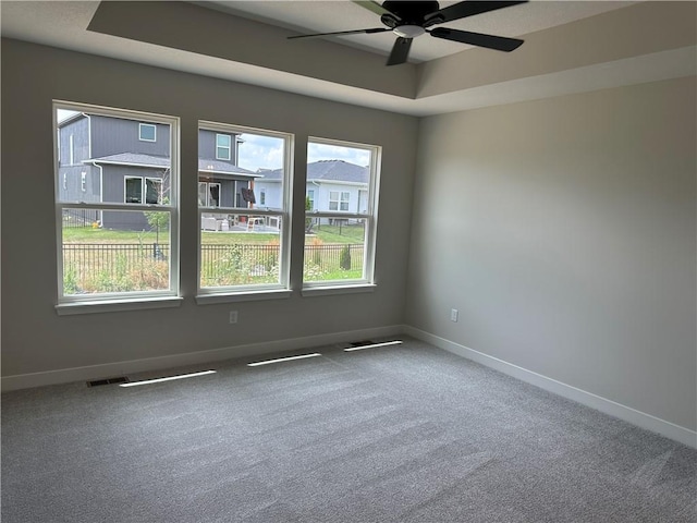 17752 Houston St, Gardner, KS 66030 - carpeted empty room with ceiling fan and a tray ceiling
