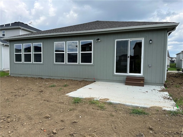 17752 Houston St, Gardner, KS 66030 - back of house with a patio area, entry steps, and a shingled roof