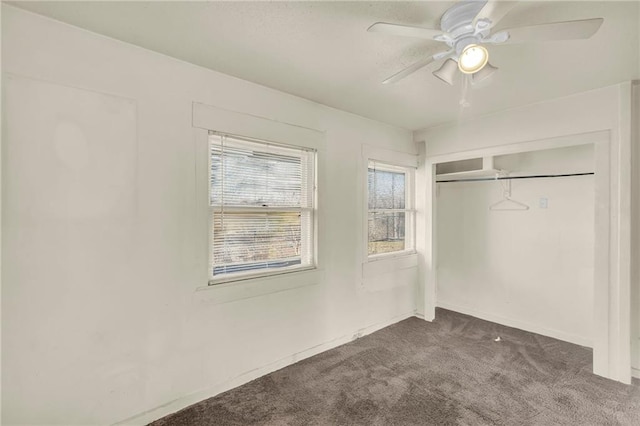 unfurnished bedroom with ceiling fan, carpet floors, and a closet