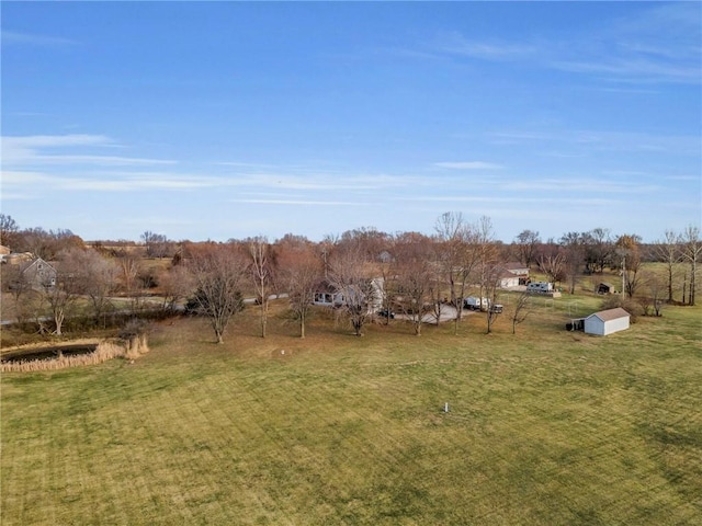 view of yard with a rural view