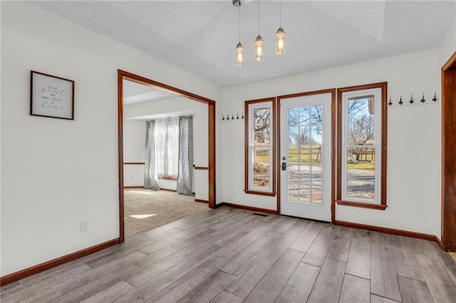 interior space with a chandelier and light wood-type flooring