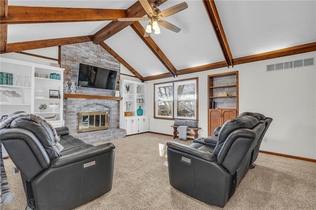 carpeted living room with lofted ceiling with beams, ceiling fan, built in features, and a brick fireplace