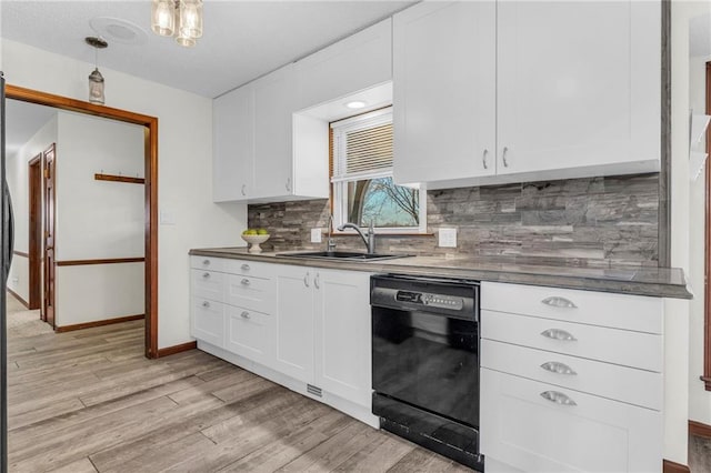 kitchen with dishwasher, light wood-type flooring, white cabinets, and sink