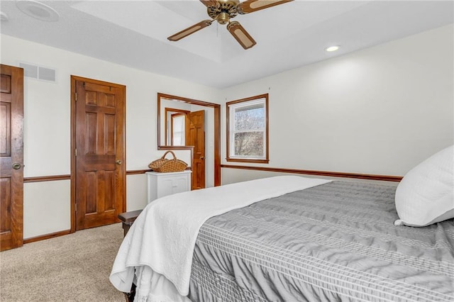 carpeted bedroom featuring ceiling fan