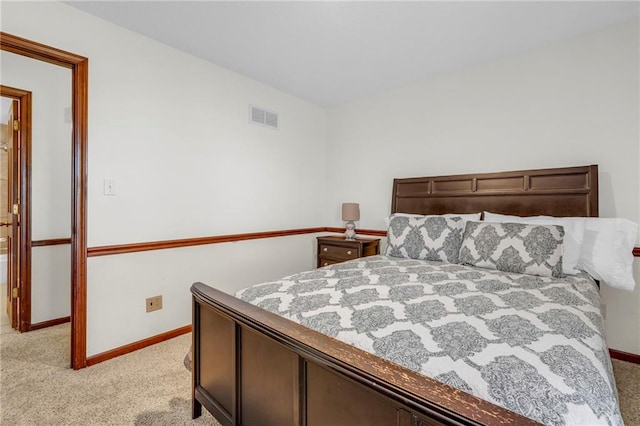 bedroom featuring light carpet