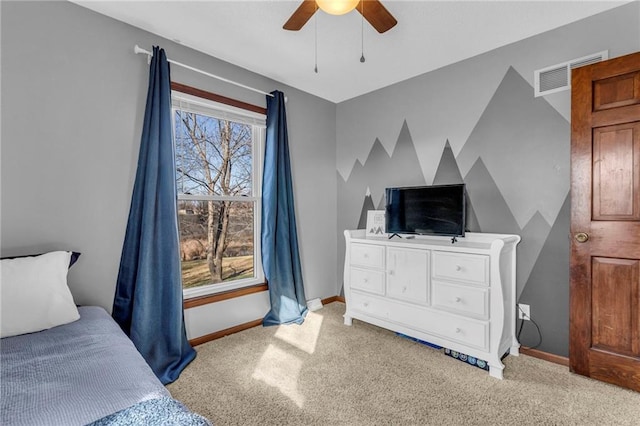 bedroom featuring light carpet and ceiling fan