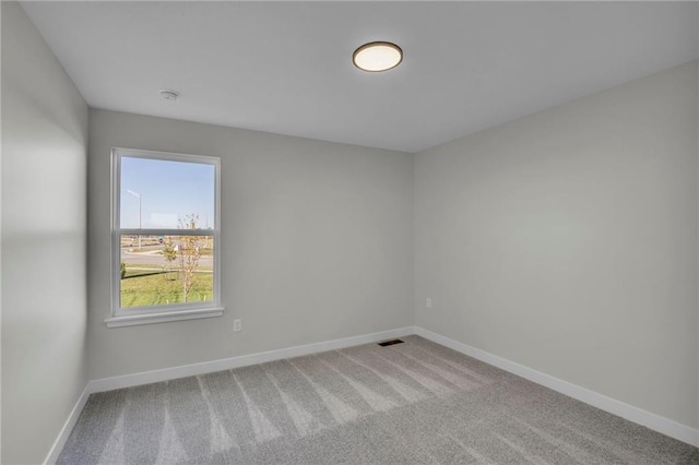 spare room featuring carpet flooring