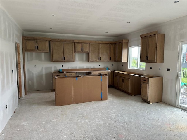 17744 Houston St, Gardner, KS 66030 - kitchen with a kitchen island and brown cabinets