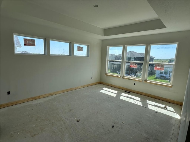 17744 Houston St, Gardner, KS 66030 - empty room featuring baseboards and a raised ceiling