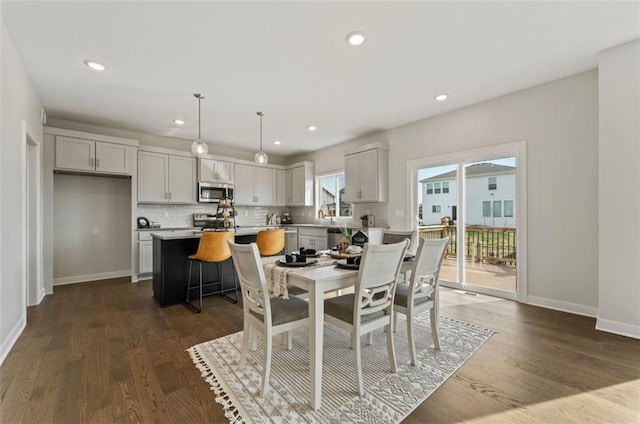 17744 Houston St, Gardner, KS 66030 - dining area featuring baseboards, dark wood-style floors, and recessed lighting