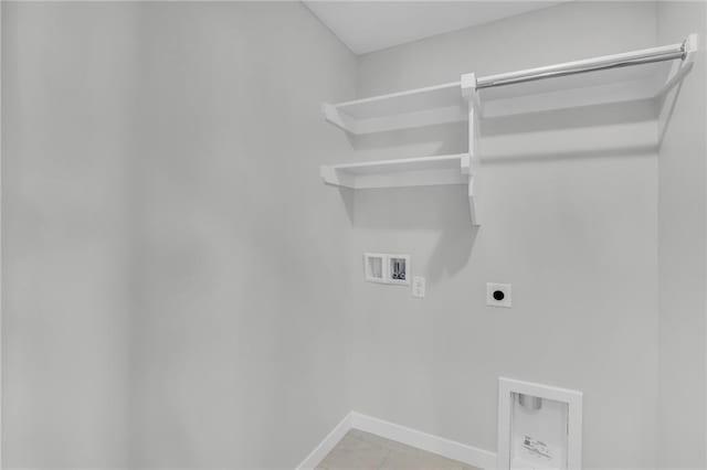 17744 Houston St, Gardner, KS 66030 - laundry room with electric dryer hookup, washer hookup, baseboards, and light tile patterned floors