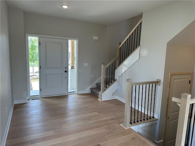 17744 Houston St, Gardner, KS 66030 - foyer featuring light wood-type flooring, recessed lighting, and stairway