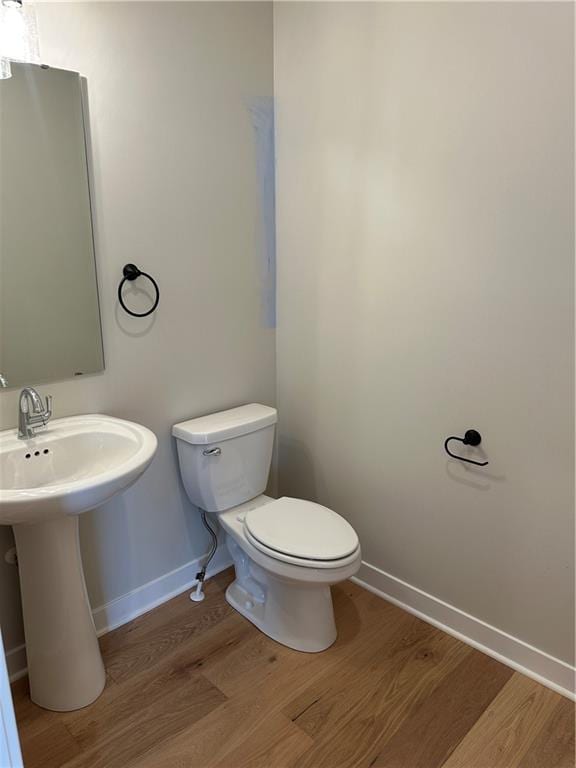 17744 Houston St, Gardner, KS 66030 - half bath featuring wood finished floors and toilet