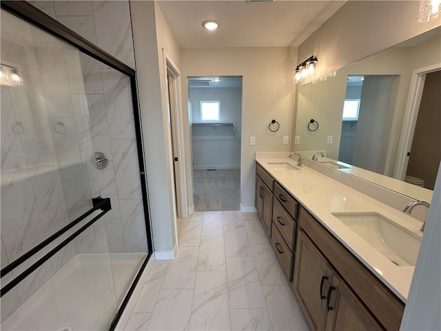 17744 Houston St, Gardner, KS 66030 - full bathroom featuring marble finish flooring, double vanity, a shower stall, a spacious closet, and recessed lighting