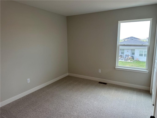 17744 Houston St, Gardner, KS 66030 - carpeted empty room with baseboards