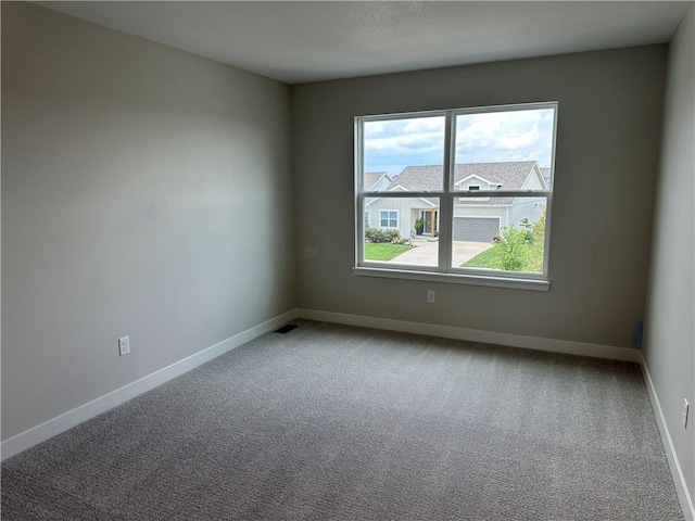 17744 Houston St, Gardner, KS 66030 - carpeted empty room with baseboards