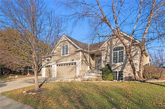 view of front of house with a garage and a front lawn