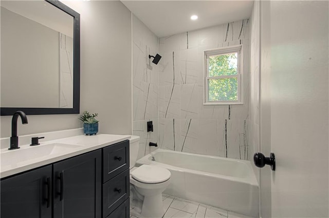 full bathroom with toilet, vanity, and tiled shower / bath combo