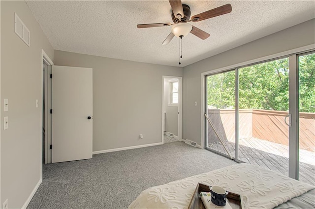 bedroom featuring ceiling fan, access to exterior, light carpet, and multiple windows