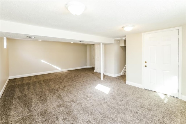 basement featuring carpet flooring