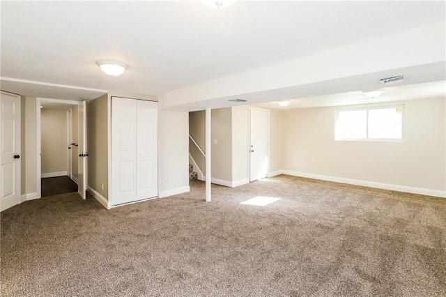 basement featuring carpet flooring