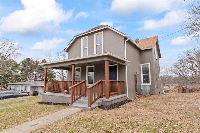 view of front of home featuring a porch, central AC unit, and a front lawn