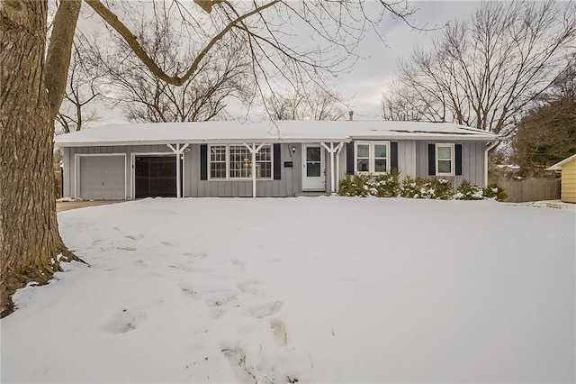 single story home featuring a garage