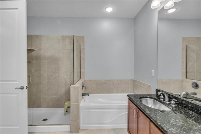 bathroom featuring tile patterned floors, vanity, and independent shower and bath