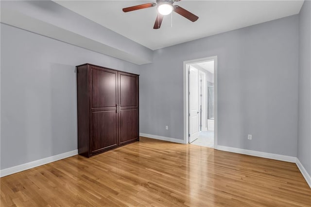 unfurnished bedroom featuring ceiling fan and light wood-type flooring