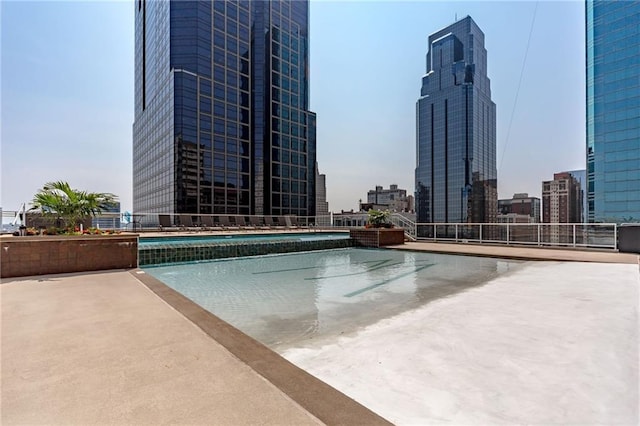 view of swimming pool featuring a patio