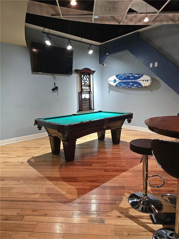 recreation room with hardwood / wood-style flooring and billiards