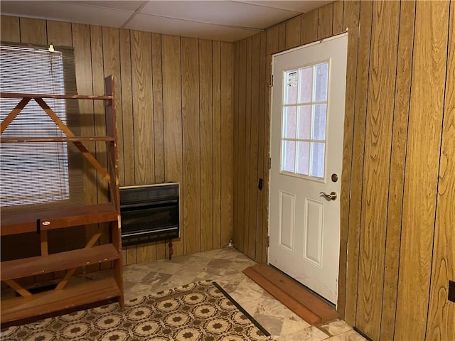 entryway featuring wooden walls