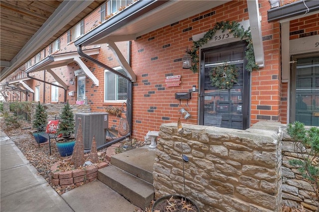 entrance to property featuring cooling unit