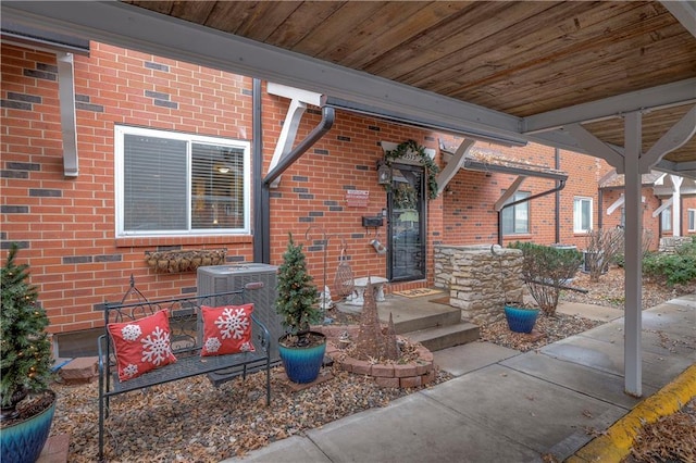 property entrance featuring central AC unit