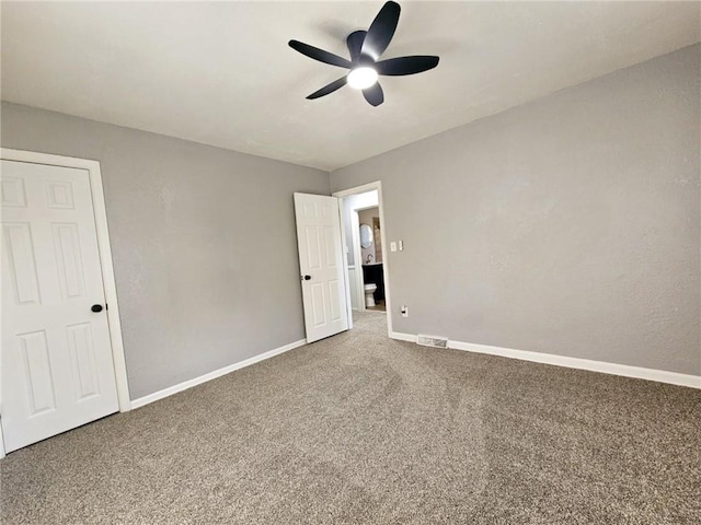 unfurnished bedroom featuring carpet and ceiling fan