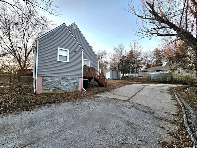 view of side of property featuring an outbuilding