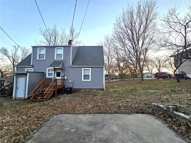 rear view of house featuring a patio area and central air condition unit