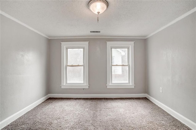 unfurnished room featuring crown molding, carpet, and a textured ceiling