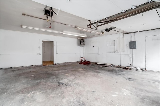 garage featuring a garage door opener and electric panel