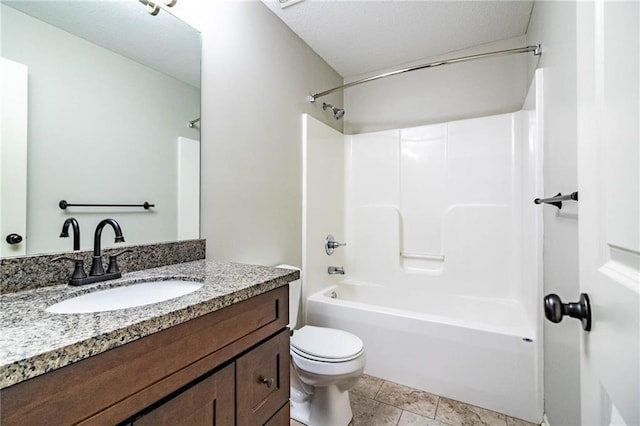 full bathroom featuring tile patterned floors, vanity, toilet, and shower / tub combination