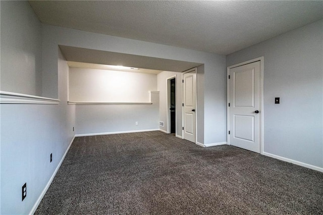 empty room featuring dark carpet