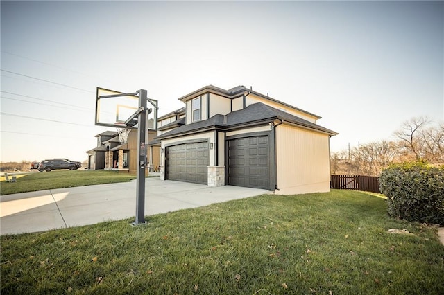 view of property exterior featuring a lawn and a garage