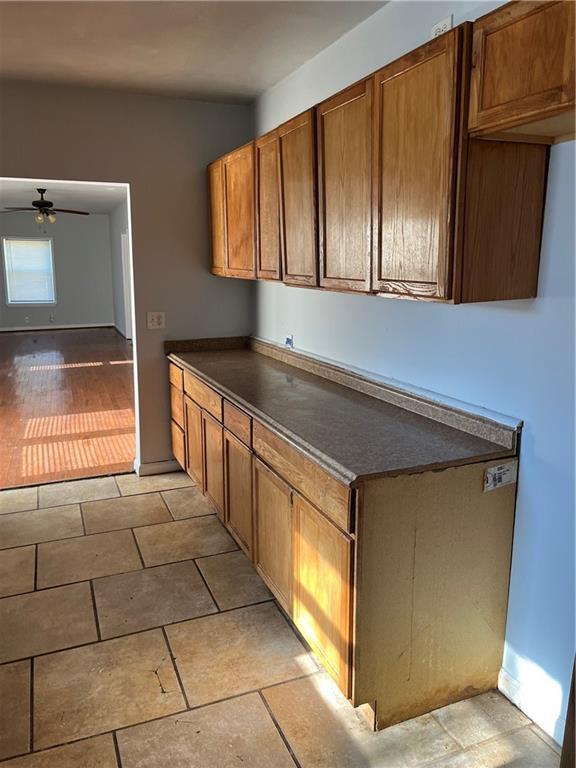 kitchen featuring light hardwood / wood-style flooring and ceiling fan