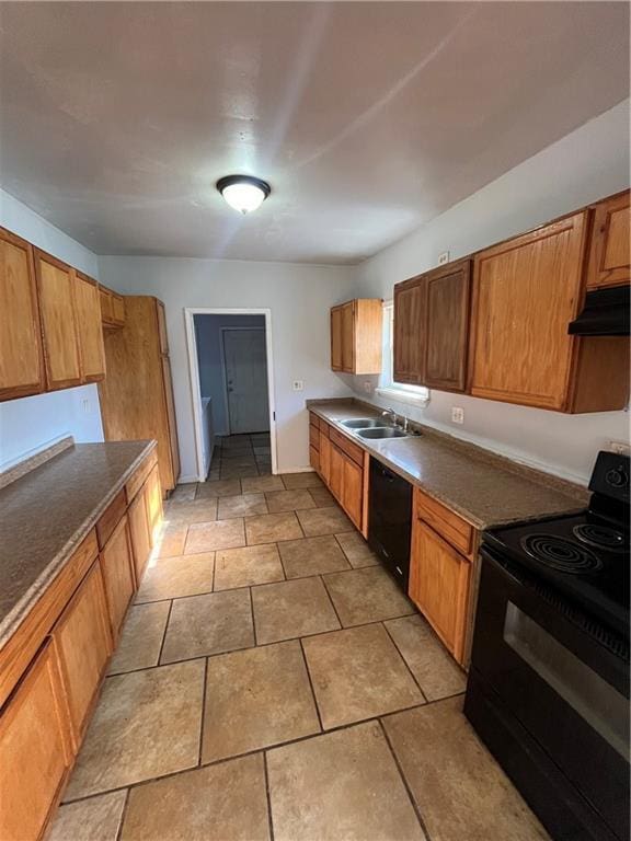 kitchen with sink, extractor fan, and black appliances