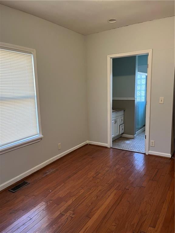 empty room featuring wood-type flooring