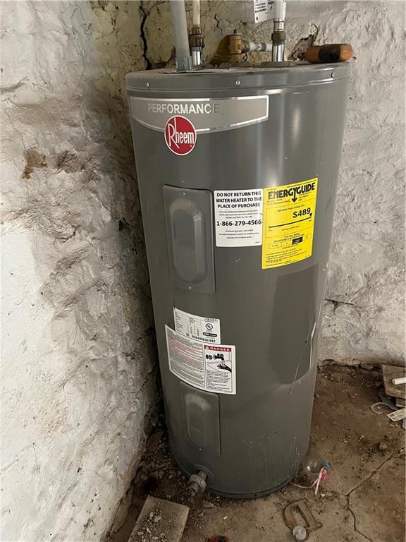 utility room featuring electric water heater