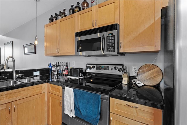 kitchen featuring light brown cabinetry, stainless steel appliances, tile counters, and sink