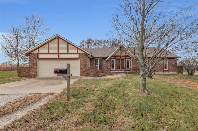 view of front of house featuring a front yard and a garage