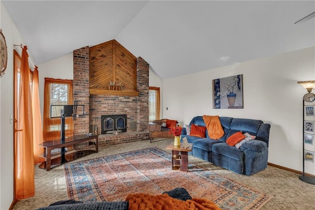 carpeted living room with lofted ceiling, a wood stove, and a healthy amount of sunlight